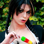 Domino Presley in pigtails sucking on an ice pop while playing with herself